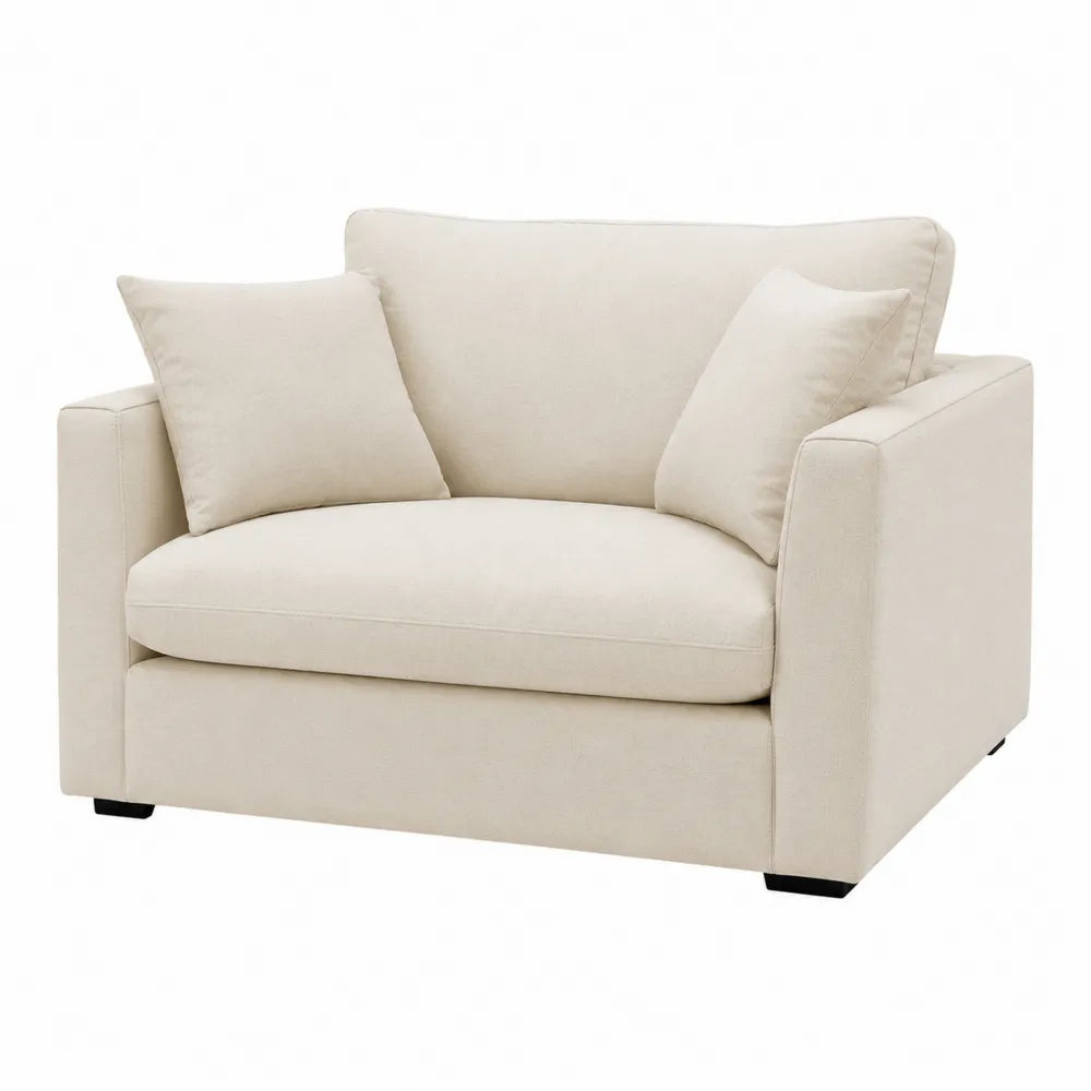 Divano in tessuto beige con cuscini